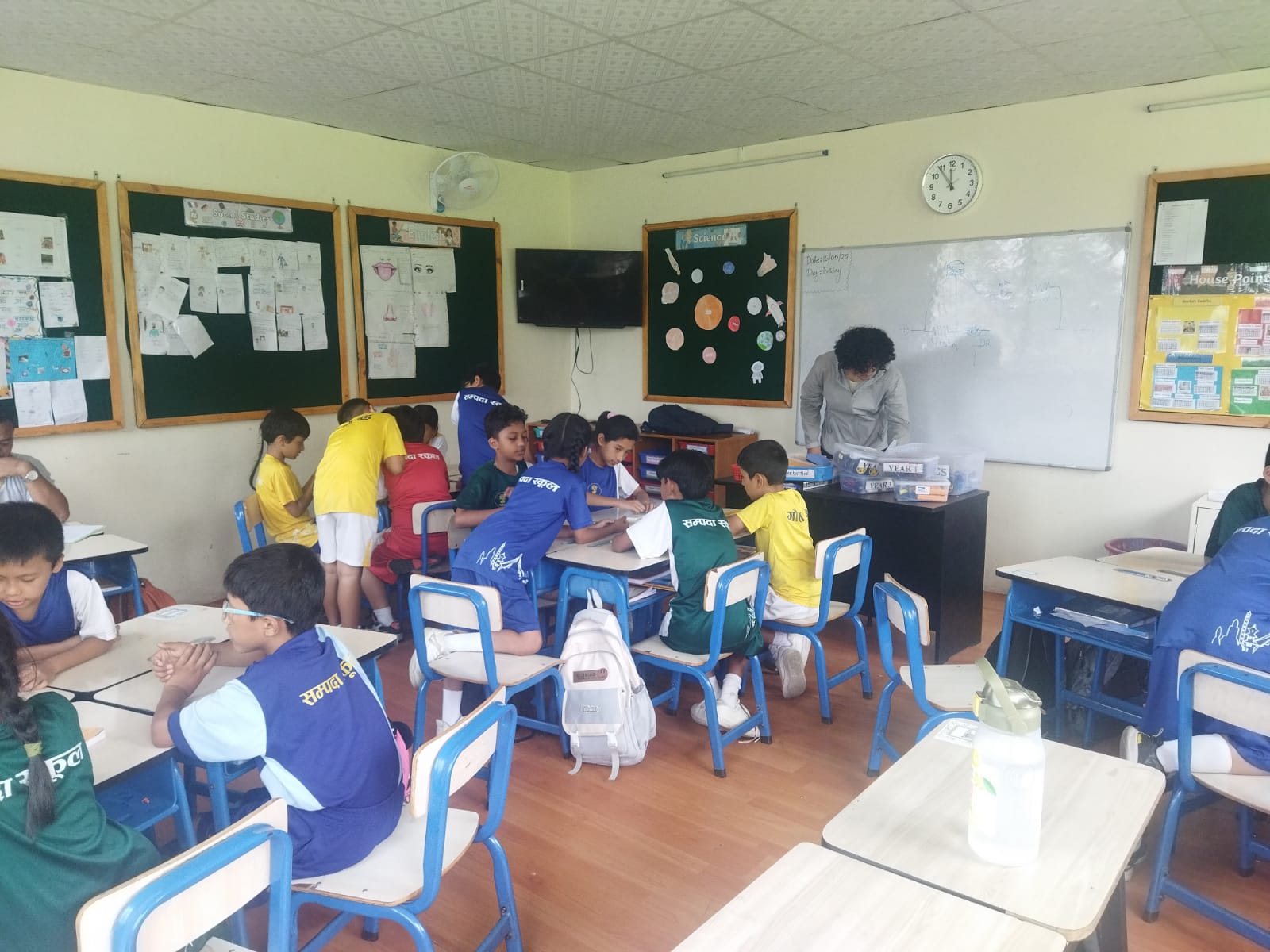 Child assembling a colorful robotics kit